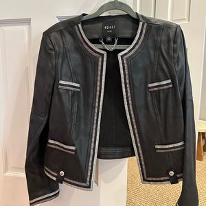 Black leather Moto jacket with. Silver trim. Size 8. Worn only twice.